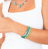 Bracciale donna rigido color oro con dettagli ispirati al mare.