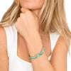 Bracciale Oceania rigido in acciaio inox waterproof color oro con finitura smaltata turchese e verde acqua.